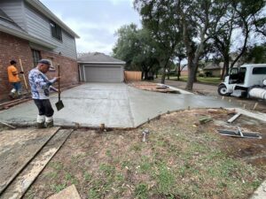 Pouring concrete driveway by Sam The Concrete Man